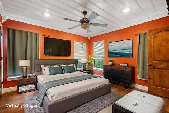 bedroom featuring ornamental molding, wood finished floors, baseboards, recessed lighting, and a ceiling fan