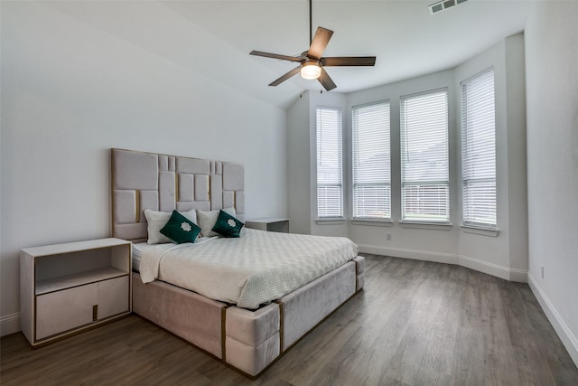 bedroom featuring wood finished floors, baseboards, and ceiling fan