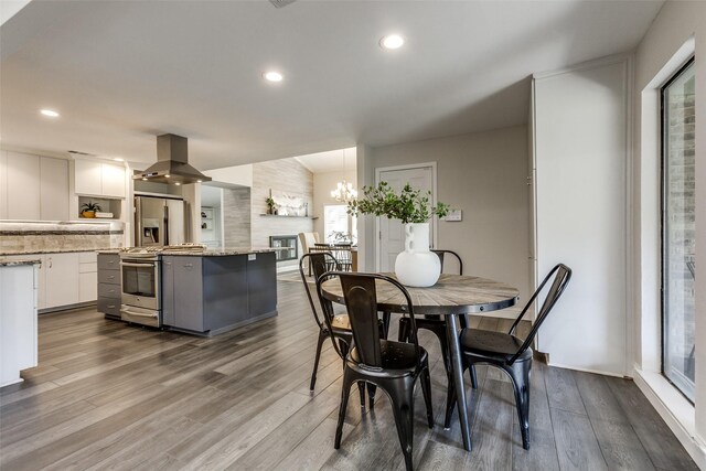 2701 W Prairie Creek Dr, Richardson, TX 75080 - dining space featuring dark wood-type flooring, a chandelier, and recessed lighting
