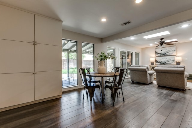 2701 W Prairie Creek Dr, Richardson, TX 75080 - dining space with a skylight, dark wood-style floors, and recessed lighting