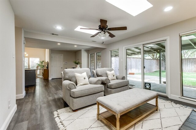 2701 W Prairie Creek Dr, Richardson, TX 75080 - living area featuring a skylight, wood finished floors, baseboards, ceiling fan, and recessed lighting