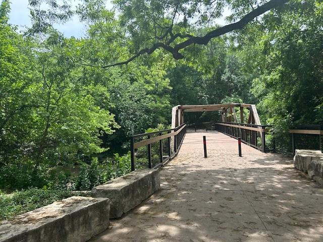 2701 W Prairie Creek Dr, Richardson, TX 75080 - view of community featuring a forest view