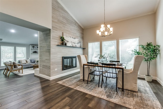 2701 W Prairie Creek Dr, Richardson, TX 75080 - dining space with dark wood finished floors, high vaulted ceiling, a chandelier, a tiled fireplace, and crown molding