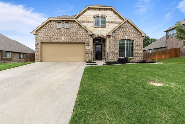 2026 Bay Laurel Dr, Weatherford, TX 76086 - french country inspired facade with a garage, driveway, and brick siding