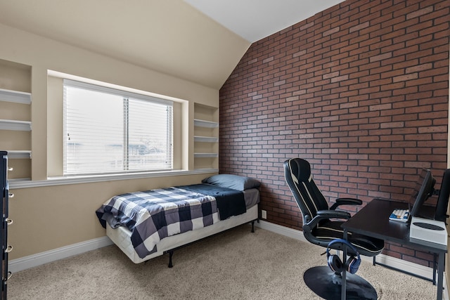 2026 Bay Laurel Dr, Weatherford, TX 76086 - carpeted bedroom with vaulted ceiling, brick wall, baseboards, and an office area
