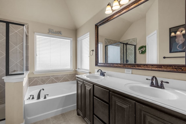 2026 Bay Laurel Dr, Weatherford, TX 76086 - bathroom featuring lofted ceiling, a shower stall, a bath, tile patterned floors, and double vanity