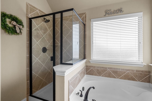 2026 Bay Laurel Dr, Weatherford, TX 76086 - full bathroom featuring a stall shower, a bath, and healthy amount of natural light