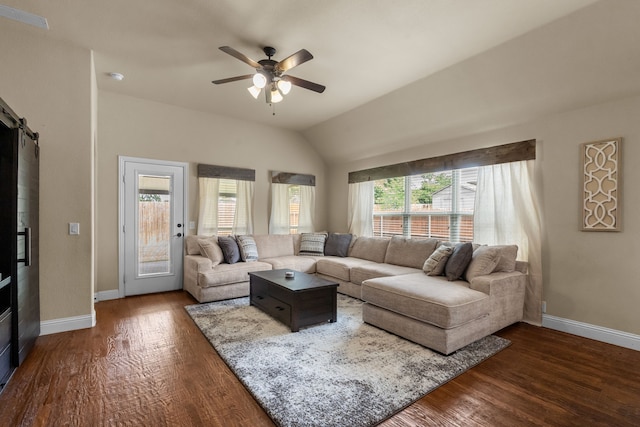2026 Bay Laurel Dr, Weatherford, TX 76086 - living room featuring a ceiling fan, baseboards, a barn door, dark wood-type flooring, and vaulted ceiling