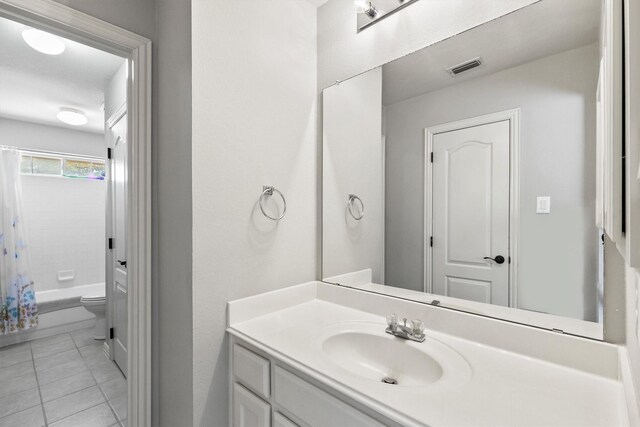 1209 Bel Air Dr, Allen, TX 75013 - bathroom featuring tile patterned flooring, vanity, toilet, and shower / bath combination with curtain