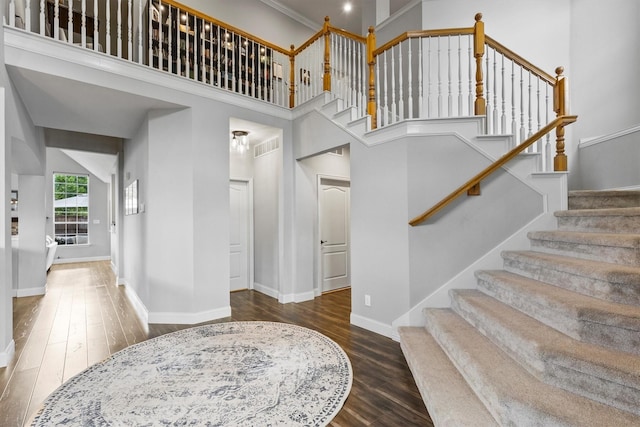 1209 Bel Air Dr, Allen, TX 75013 - entryway with wood finished floors, baseboards, stairs, and a towering ceiling