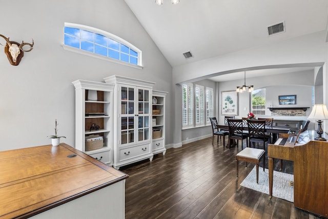 1209 Bel Air Dr, Allen, TX 75013 - home office featuring a chandelier, high vaulted ceiling, arched walkways, and wood finished floors