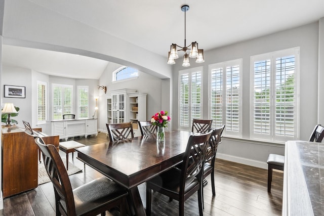 1209 Bel Air Dr, Allen, TX 75013 - dining space featuring dark wood finished floors, a chandelier, arched walkways, vaulted ceiling, and baseboards