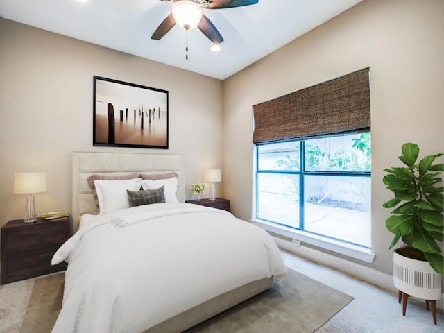 carpeted bedroom featuring baseboards, ceiling fan, and recessed lighting