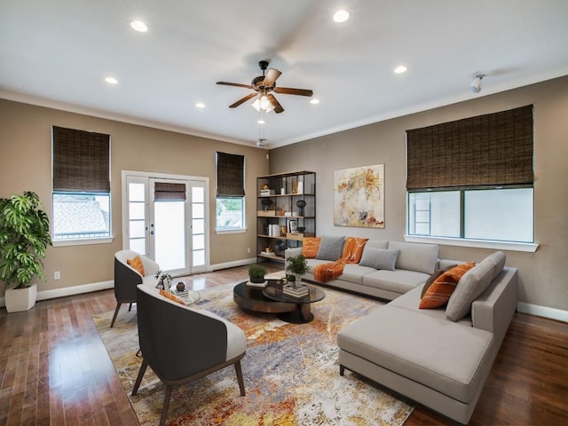 living area with healthy amount of natural light, baseboards, ceiling fan, wood finished floors, and recessed lighting