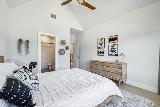4141 Splitrock Dr, Prosper, TX 75078 - bedroom with high vaulted ceiling, baseboards, wood finished floors, connected bathroom, and ceiling fan