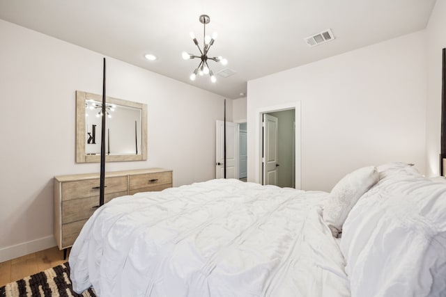 4141 Splitrock Dr, Prosper, TX 75078 - bedroom featuring wood finished floors, a chandelier, baseboards, and recessed lighting