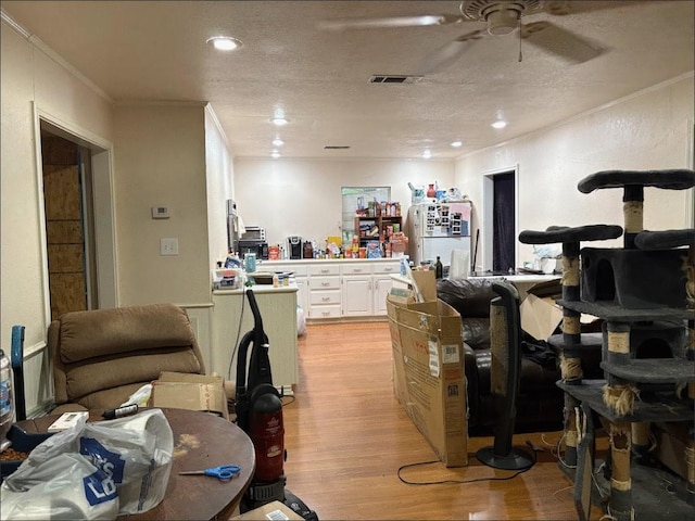 8207 Double Bridge Rd, Mabank, TX 75156 - miscellaneous room featuring ornamental molding, light wood finished floors, and a ceiling fan