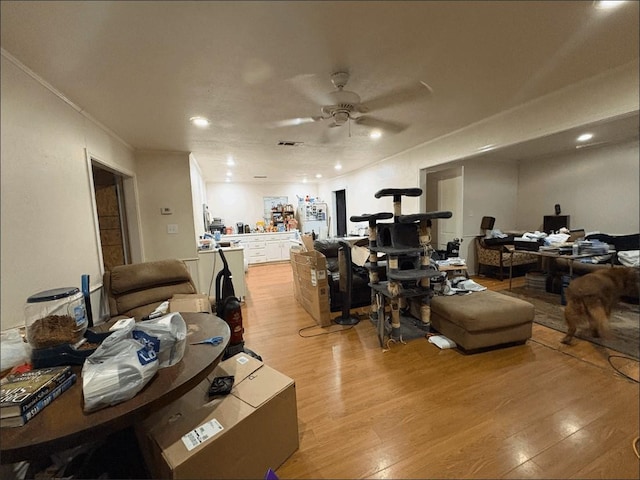 8207 Double Bridge Rd, Mabank, TX 75156 - living room featuring a ceiling fan, light wood finished floors, ornamental molding, and recessed lighting