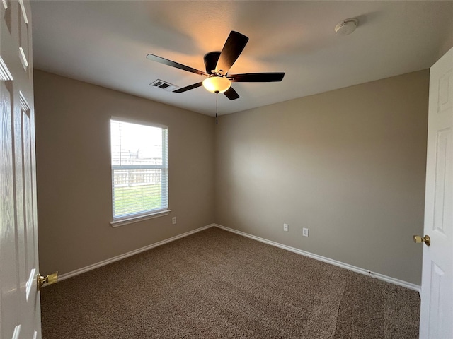 3108 Bryce Dr, Wylie, TX 75098 - empty room featuring dark carpet, ceiling fan, and a smoke detector