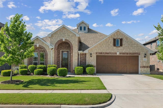 432 Sagebrush Dr, Aledo, TX 76008 - french country home featuring a garage, driveway, and stone siding