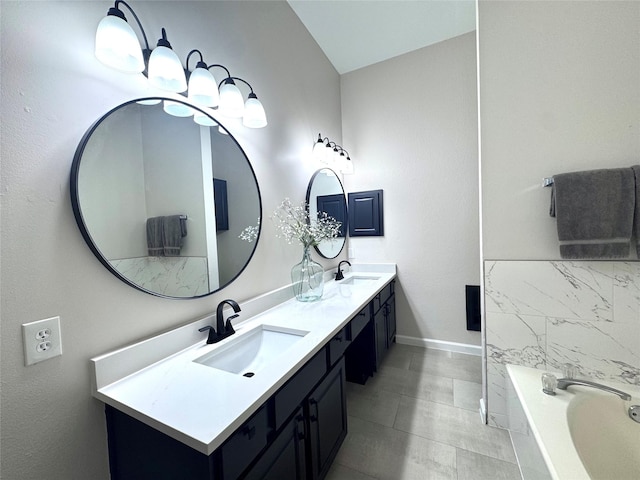 425 N Gaston Dr, Wylie, TX 75098 - full bathroom featuring double vanity, a bath, and baseboards
