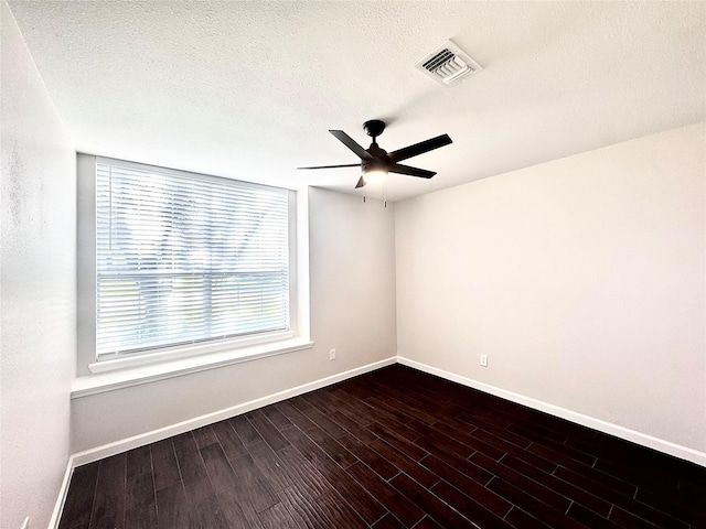 425 N Gaston Dr, Wylie, TX 75098 - empty room with baseboards, a ceiling fan, dark wood-style flooring, and a textured ceiling