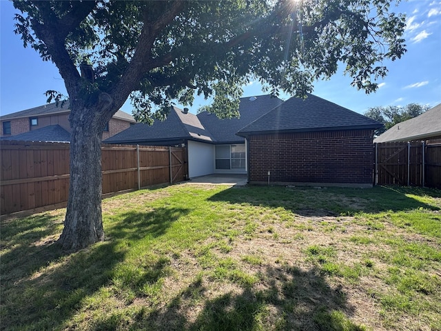 425 N Gaston Dr, Wylie, TX 75098 - rear view of house with brick siding and roof with shingles