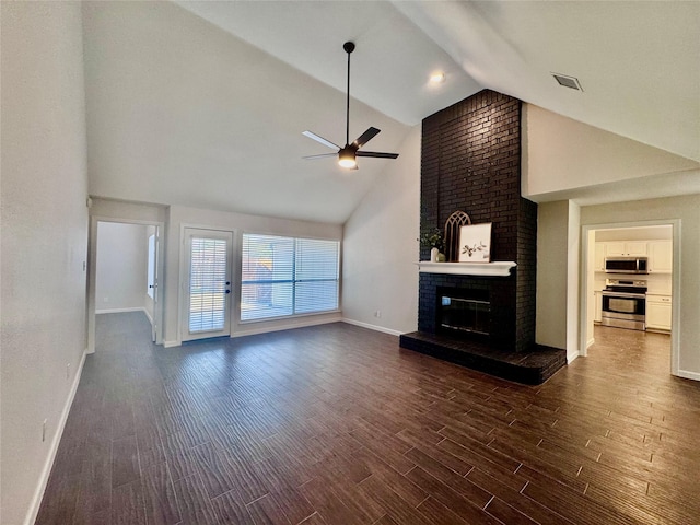 425 N Gaston Dr, Wylie, TX 75098 - unfurnished living room featuring high vaulted ceiling, ceiling fan, a brick fireplace, dark wood-style flooring, and baseboards