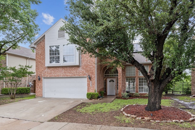 9434 Abbey Rd, Irving, TX 75063 - view of front of home with a garage, fence, concrete driveway, and brick siding