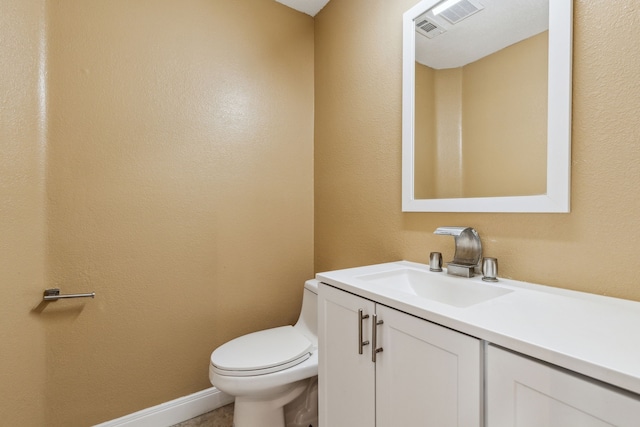 9434 Abbey Rd, Irving, TX 75063 - bathroom featuring toilet, vanity, and baseboards