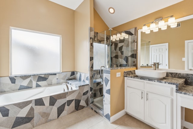 9434 Abbey Rd, Irving, TX 75063 - bathroom featuring a shower stall, tile patterned floors, a garden tub, vanity, and lofted ceiling