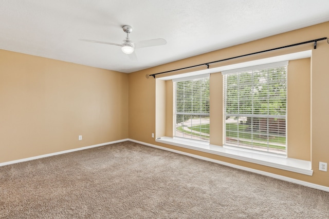9434 Abbey Rd, Irving, TX 75063 - empty room with carpet flooring, healthy amount of natural light, a ceiling fan, and baseboards