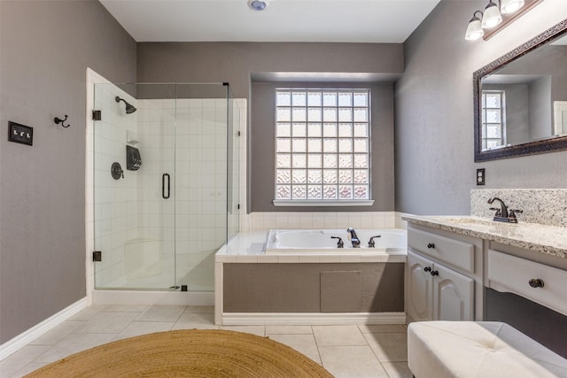 7200 Randall Way, Plano, TX 75025 - bathroom featuring a stall shower, a garden tub, vanity, tile patterned flooring, and baseboards