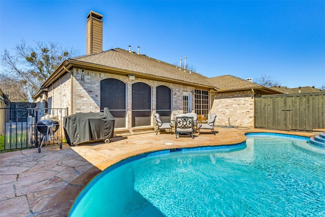 7200 Randall Way, Plano, TX 75025 - view of swimming pool with a patio area, fence, a gate, and a grill