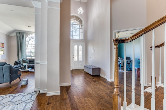 7200 Randall Way, Plano, TX 75025 - foyer with decorative columns, high vaulted ceiling, dark wood-style floors, baseboards, and crown molding