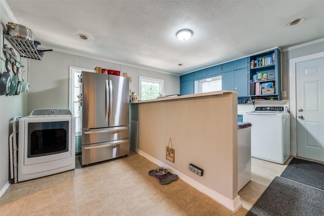 1119 Mccormick St, Denton, TX 76201 - kitchen with freestanding refrigerator, open shelves, blue cabinetry, crown molding, and a textured ceiling