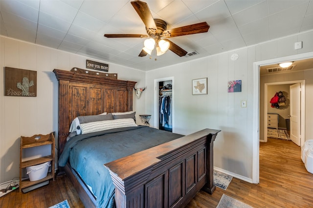 1119 Mccormick St, Denton, TX 76201 - bedroom featuring dark wood-style floors, baseboards, a closet, and a ceiling fan