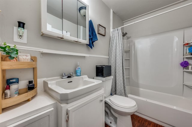 1119 Mccormick St, Denton, TX 76201 - bathroom with toilet, wood finished floors, shower / bath combo with shower curtain, and vanity