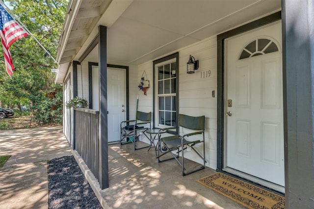 1119 Mccormick St, Denton, TX 76201 - doorway to property featuring covered porch