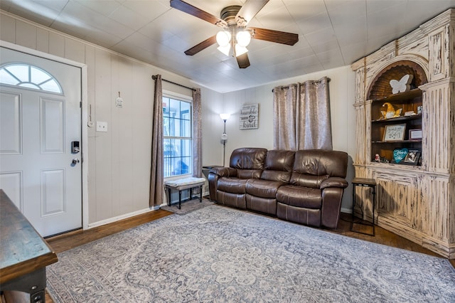 1119 Mccormick St, Denton, TX 76201 - living area with ceiling fan, wood finished floors, baseboards, and crown molding