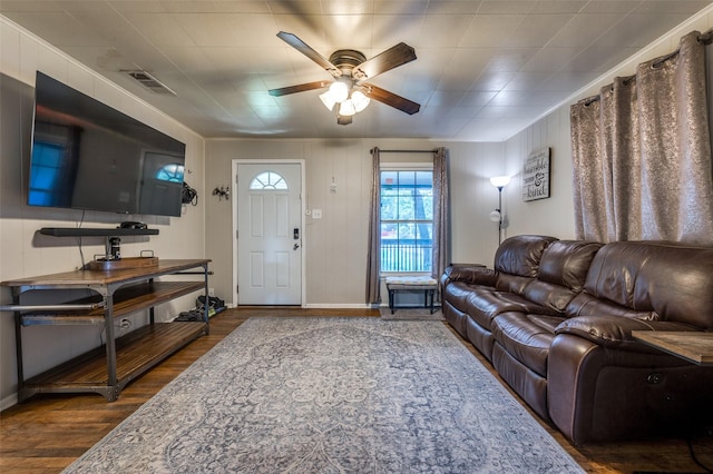 1119 Mccormick St, Denton, TX 76201 - living room featuring a ceiling fan, dark wood-style flooring, and baseboards