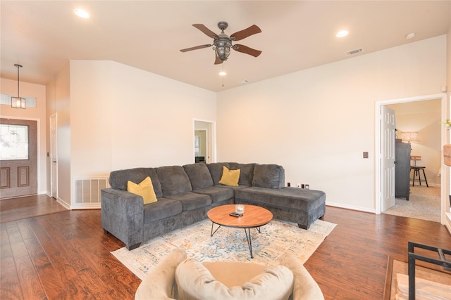 living room featuring a ceiling fan, baseboards, wood finished floors, and recessed lighting