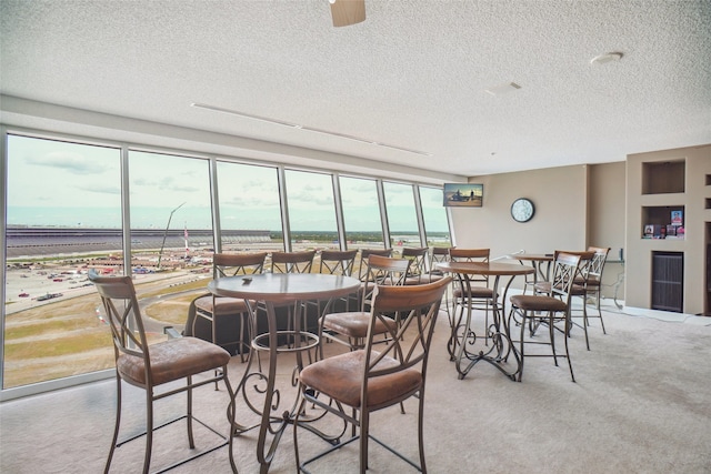dining space with a textured ceiling