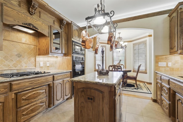 9008 Reata W Dr, Benbrook, TX 76126 - kitchen featuring black appliances, a chandelier, decorative backsplash, ornamental molding, and a kitchen island