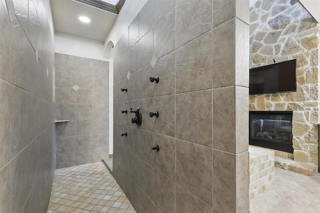 9008 Reata W Dr, Benbrook, TX 76126 - full bath with tiled shower, a stone fireplace, and tile patterned floors