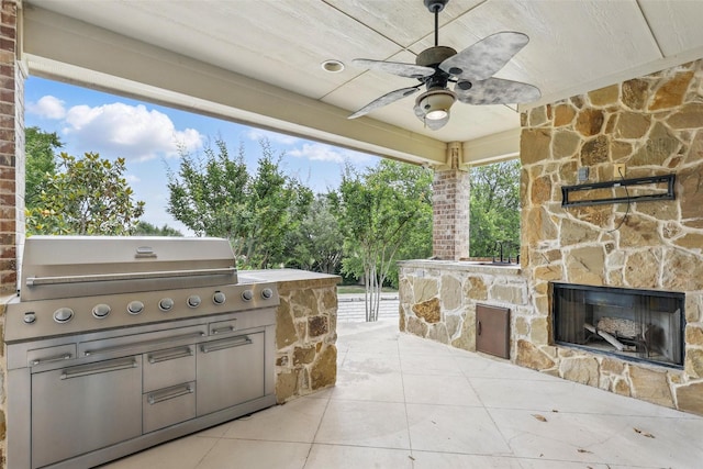 9008 Reata W Dr, Benbrook, TX 76126 - view of patio with an outdoor stone fireplace, a grill, an outdoor kitchen, and a ceiling fan