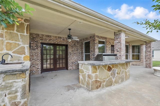 9008 Reata W Dr, Benbrook, TX 76126 - view of patio / terrace featuring a ceiling fan, french doors, exterior bar, area for grilling, and exterior kitchen