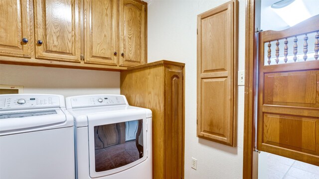 309 W 5th St, Justin, TX 76247 - clothes washing area featuring washer and dryer, cabinet space, and tile patterned floors