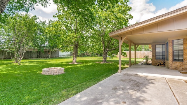 309 W 5th St, Justin, TX 76247 - view of yard featuring an outdoor fire pit and a patio area