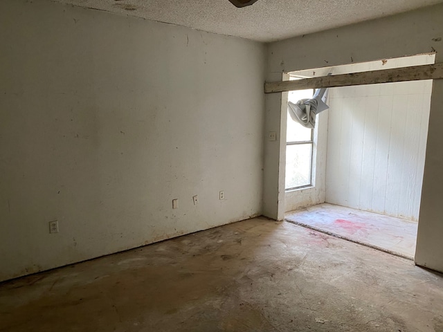 207 County Road 1739, Yantis, TX 75497 - spare room featuring concrete floors and a textured ceiling